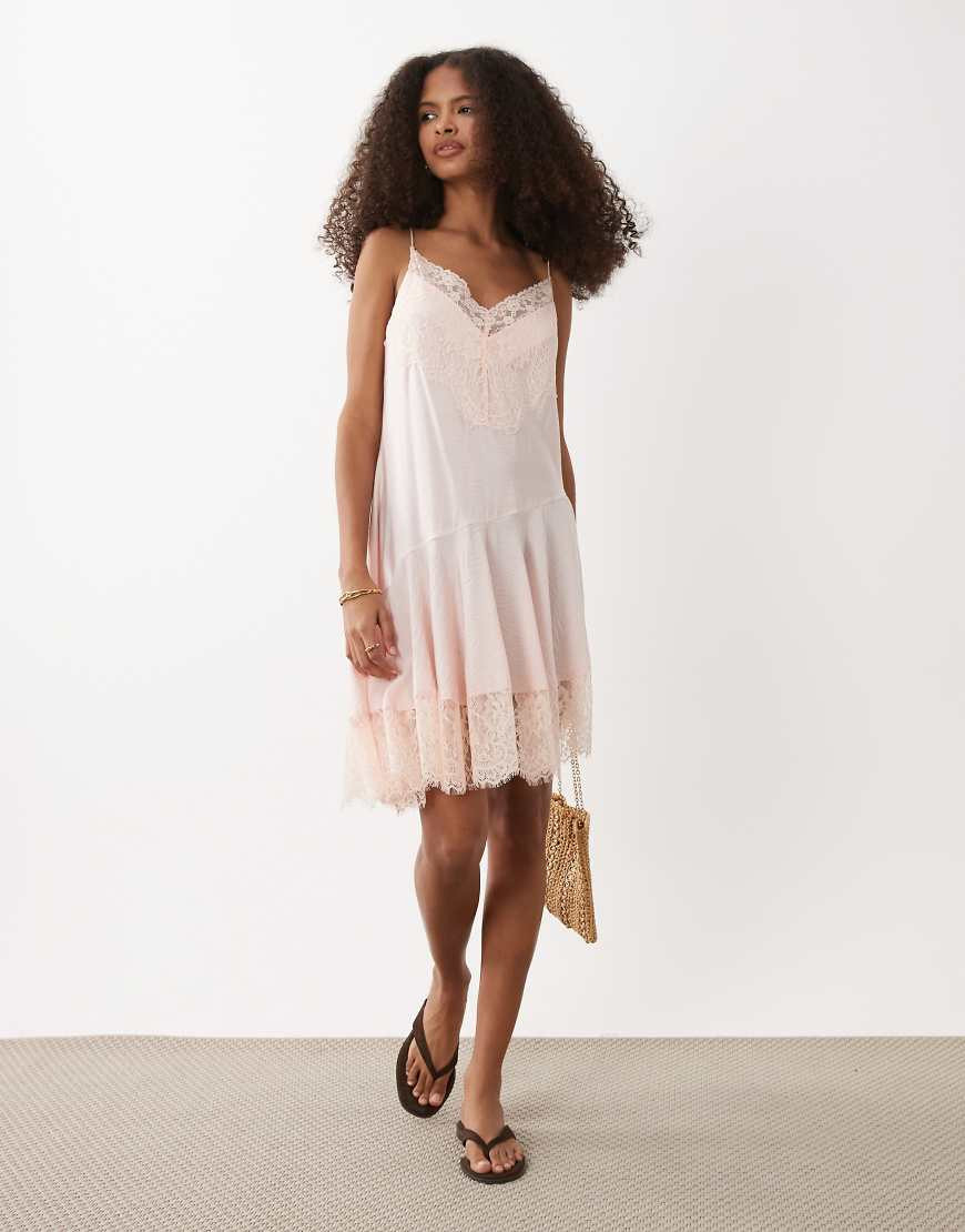 ASOS DESIGN lace trim mini slip dress with asymmetric hem in pale pink | ASOS (Global)