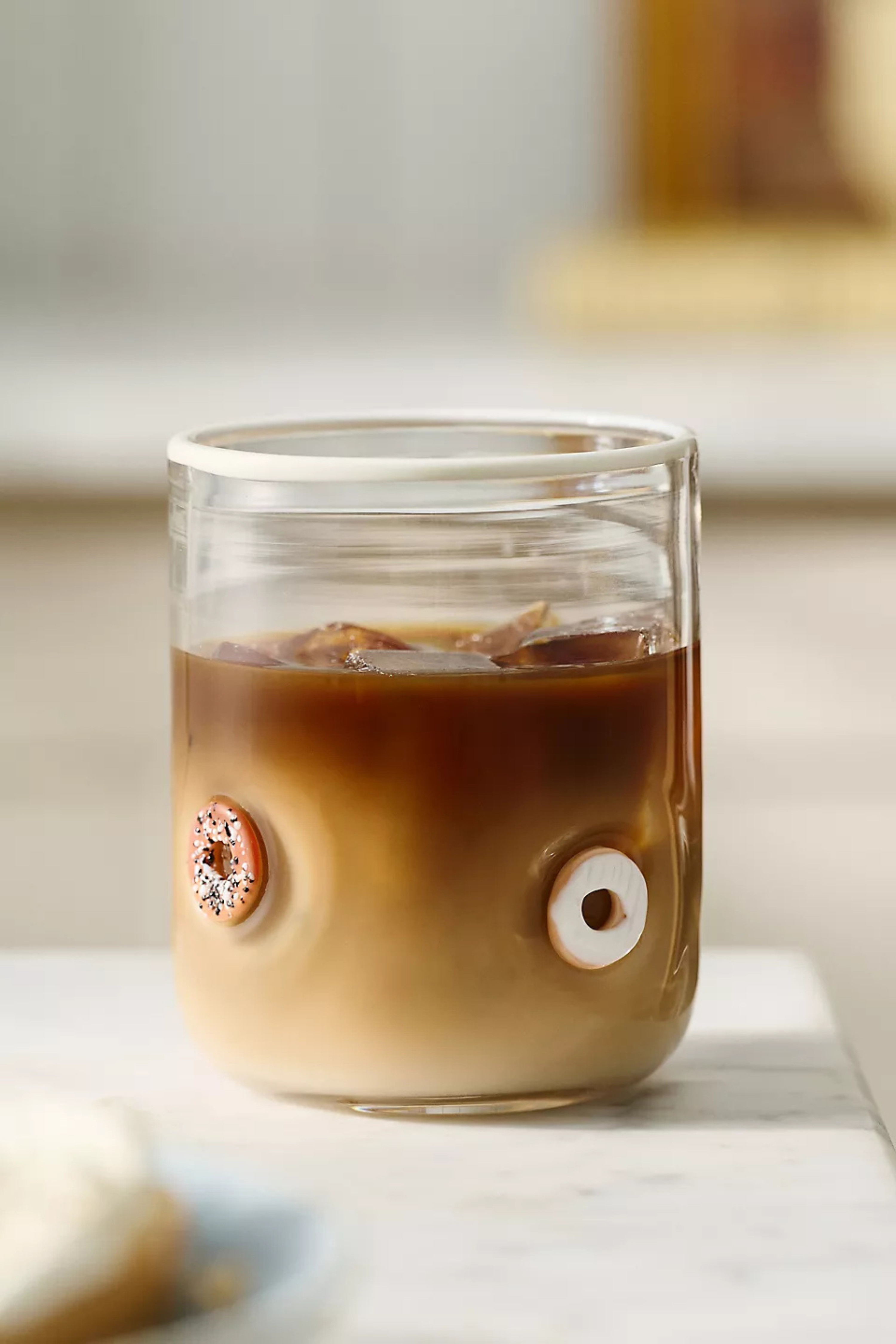 Serving sprinkles, smiles, and a little bit of whimsy 🍩✨ These donut icon glasses from Anthropologie are the sweetest way to elevate your morning coffee, afternoon iced latte, or late-night sweet treat. Because everyday moments deserve a little extra fun. 🤍

#AnthropologieHome #AnthroFinds #GlasswareLove #CoffeeBarStyling #KitchenInspo #HomeDecorFinds #CuteHomeFinds #AnthropologieFinds #DonutLover #EverydayLuxury 

 #LTKmorningroutine #LTKHome
