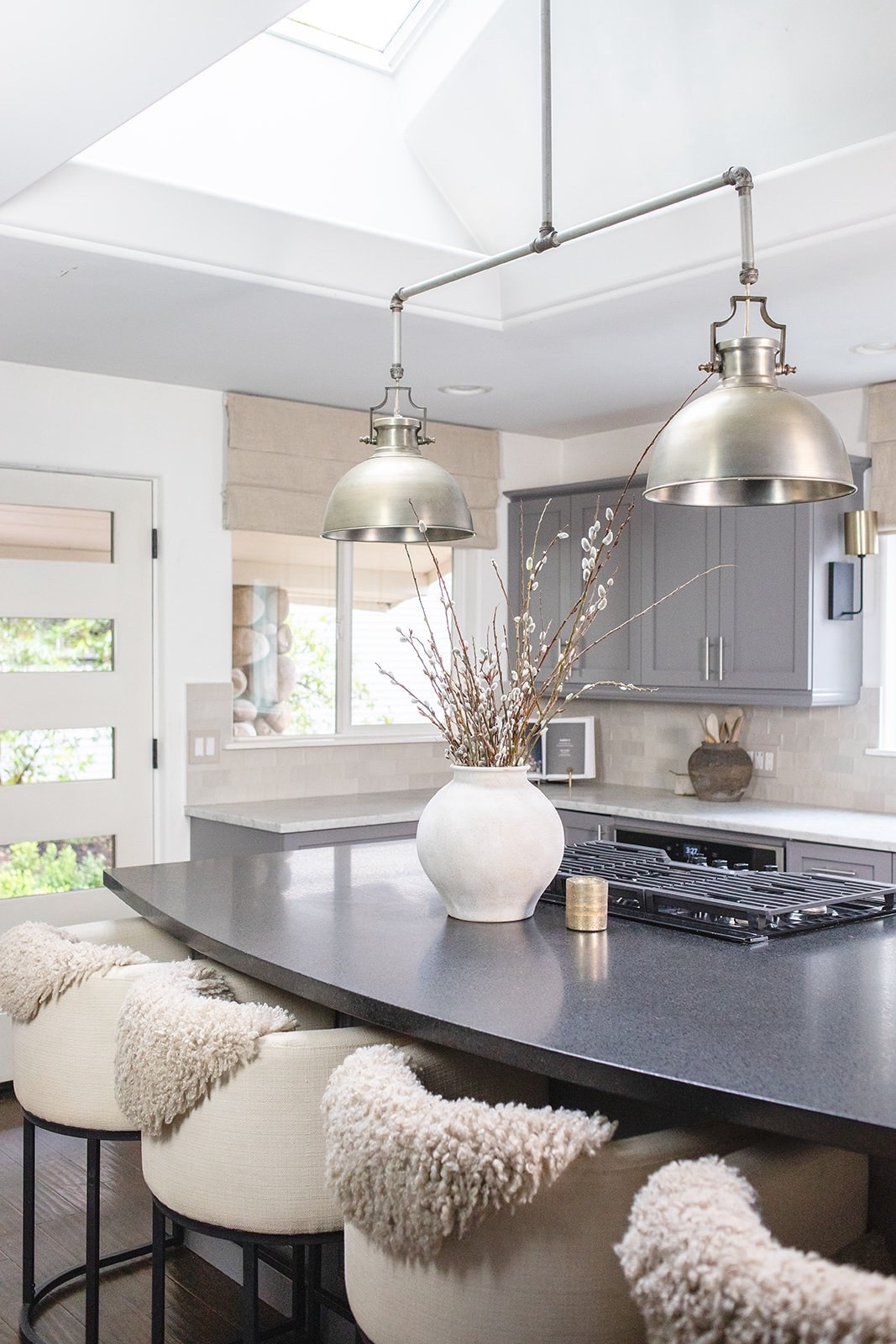 Neutral Modern Kitchen Island Styling

If you love a neutral modern kitchen with a high-end, Restoration Hardware inspired feel, this look is all about layering warm textures with clean lines. I kept the palette soft and cohesive with creamy upholstered counter stools, a simple oversized ceramic vase with natural branches, and warm metallic accents to tie in the industrial pendant lighting.

This is one of my favorite ways to style a kitchen island so it feels elevated but still functional and uncluttered. The mix of soft textiles, matte finishes, and subtle contrast creates that cozy, lived-in look without feeling busy.

Everything here is timeless, versatile, and easy to recreate in your own home. Shop the stools, decor, lighting, and kitchen details through my links.

#LTKHome #LTKSaleAlert #LTKSeasonal