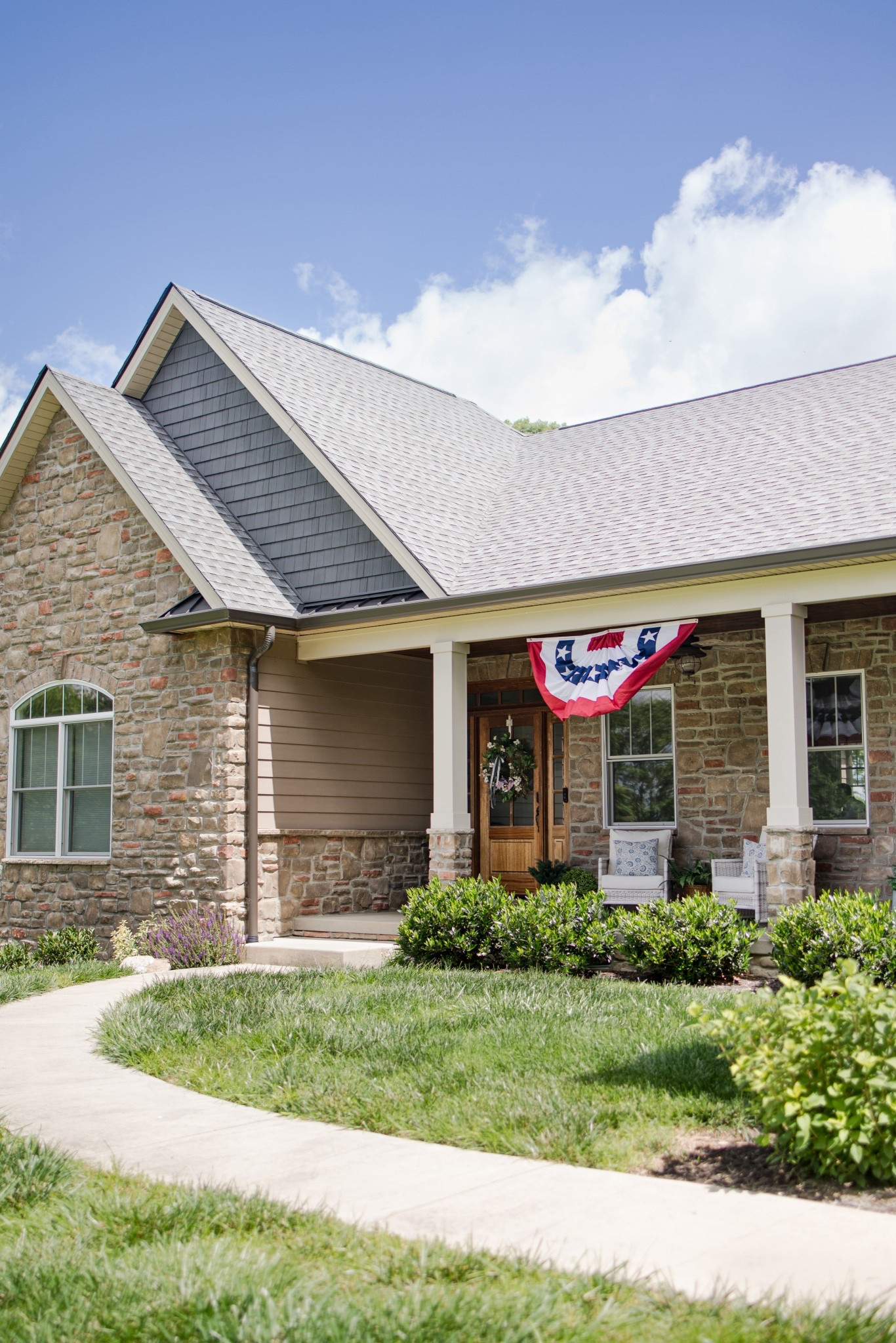Memorial Day ready with flag bunting on the front porch 

#LTKSeasonal #LTKHome #LTKFindsUnder50