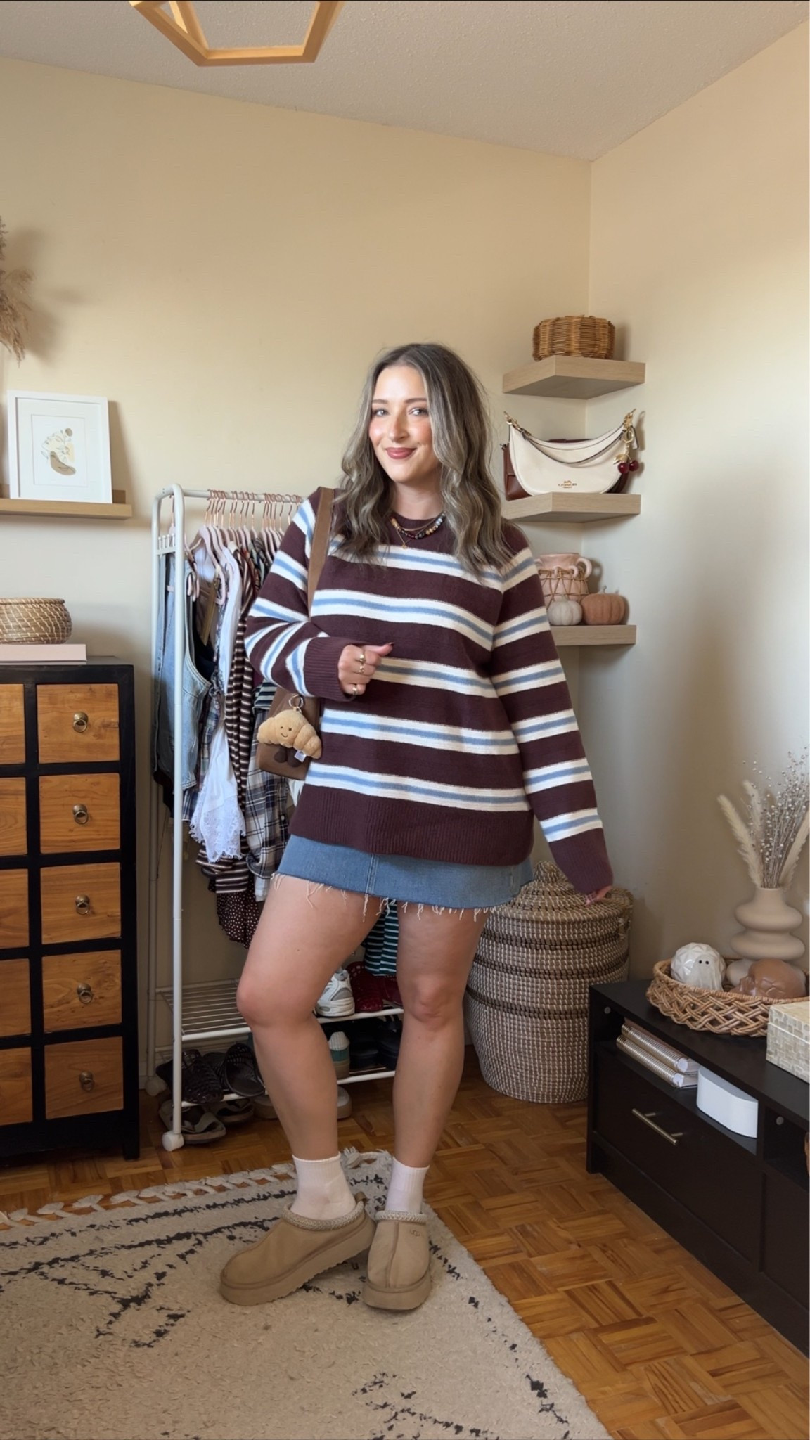 Comfy fall outfit! Sized up to XL in the striped sweater for an oversized fit. I bought the denim skirt last year, wearing size 32, would buy a 31 if I was purchasing now. I’m a 9.5-10 shoe and wear a 10 in the Uggs

#LTKfall #LTKstyletip #LTKmidsize