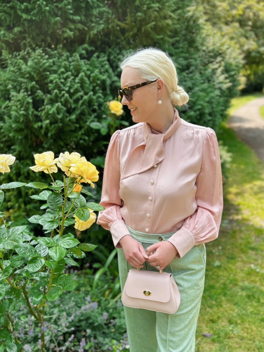 Wearing the ultra feminine Hall pink blouse with pearl buttons from the SS25 LK Bennett London collection, which I partnered with light green wide leg wool trousers I found in the Oliver Bonas sale, pearl drop earrings from Lido Pearls, tortoiseshell sunglasses by Ralph Lauren and the pink Mini Holly top handle bag by Tusting. Enjoy a 15% discount on all full price styles at LK Bennett with discount code REBECCALIPKINAUTHOR15 

#pink #ladylike #trouseroutfit #discountcode 

#LTKuk #LTKeurope #LTKsummer