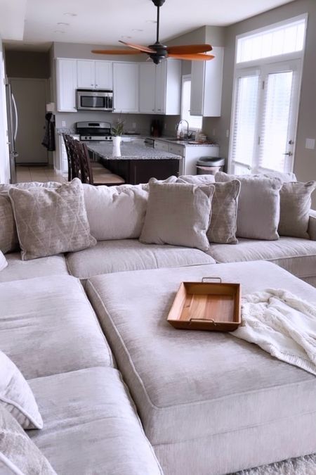 Living room sectional and ottoman 

#livingroom #family

#LTKstyletip #LTKhome #LTKSeasonal