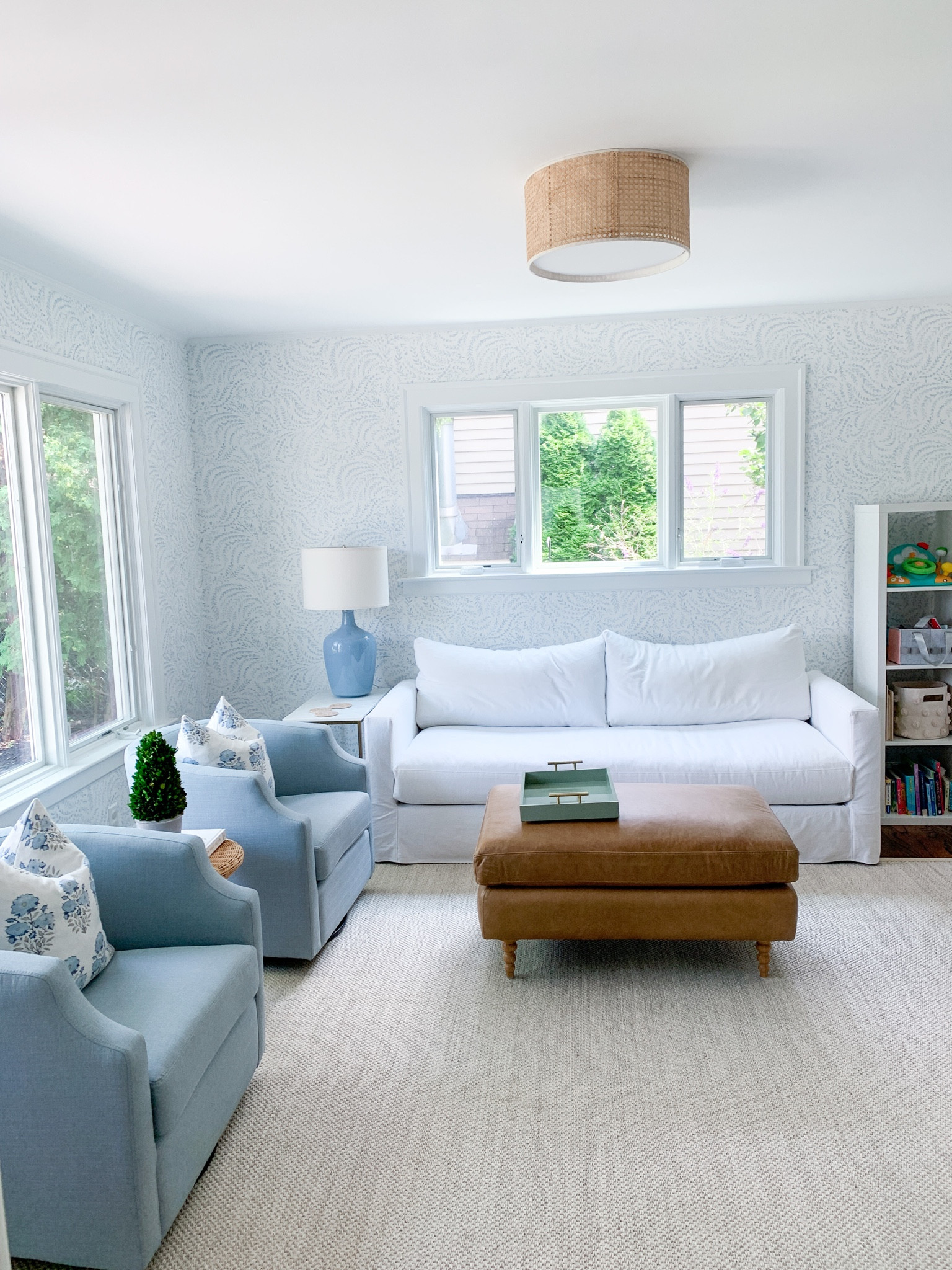 Living room, home decor, white couch, light blue swivel chair, rattan light, flush mount light 

#LTKhome #LTKFind #LTKunder100