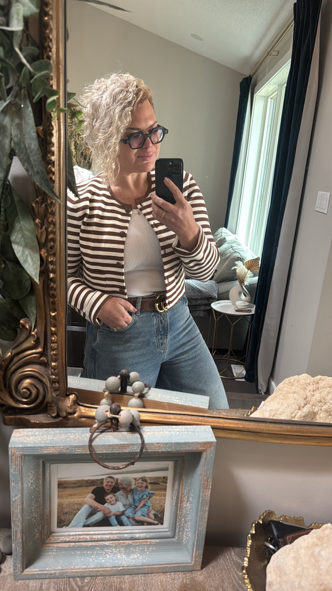 These CARDIGANS 🤎 I have so many of them in different colours. I wear a medium - when done up I did the buttons still gape (I’m a 36D) but like to wear them open anyways. Sleeves are LONG, so I roll them up, but you’d never know. 
Torso is cropped, keep that in mind. 

Wearing a large in the tank under - very fitted. 

Jeans fit true to size, ankle length on me (I’m 5’3) 

#LTKstyletip #LTKjeans #LTKwinter