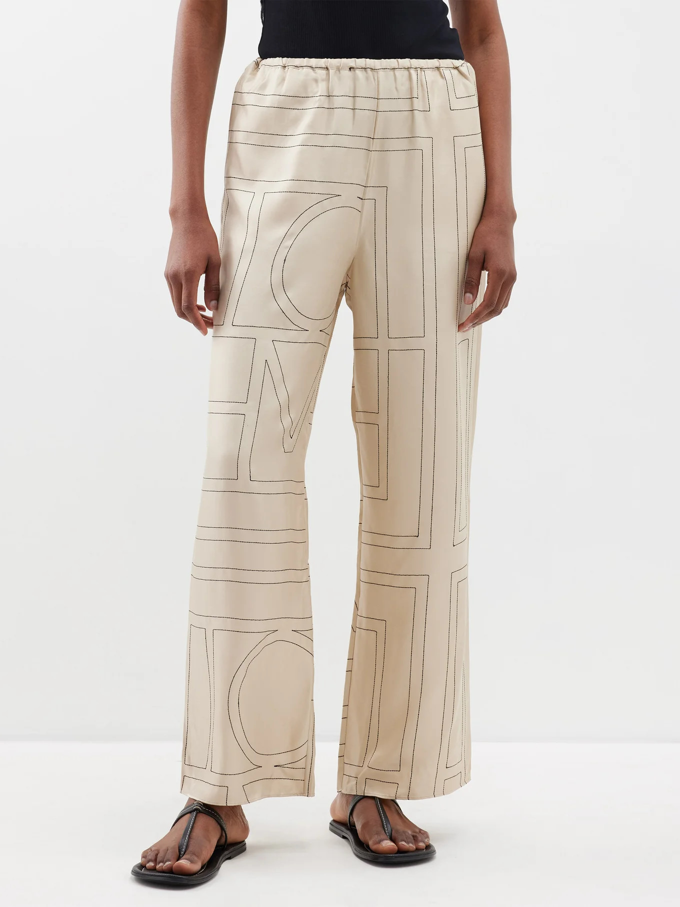 Monogram-embroidered silk-twill pyjama trousers | Toteme | Matches (US)