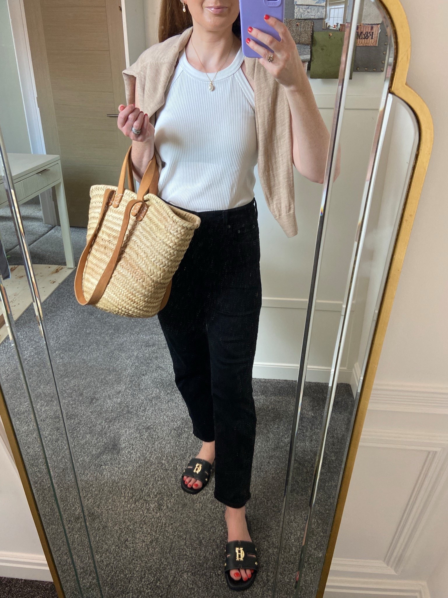 Market mornings done right 🖤🤍
Wearing my go-to black Levi’s jeans paired with a cream Uniqlo halterneck bra top — lightweight and perfect for warm days. I’ve draped my tan cardi over my shoulders for that effortless “just in case” summer layering, and slipped on my new Holland Cooper black monogram slides (obsessed!). Finished with my trusty market tote for that classic country feel 🥐🍍🌿 

#LTKSeasonal #LTKSummerEdit #LTKOver40