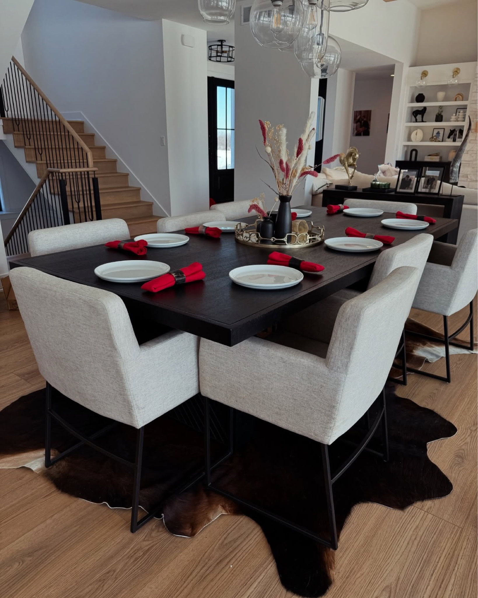 All the cowhide feels! We used the cowhides for our wedding down the aisle. I decided to incorporate them in our home by placing two of them under our dining room table. I love how it turned out and can’t wait to show you where we put the rest of them! 

#cowhiderugs #homedesign #diningroomdesign #modernranchhome