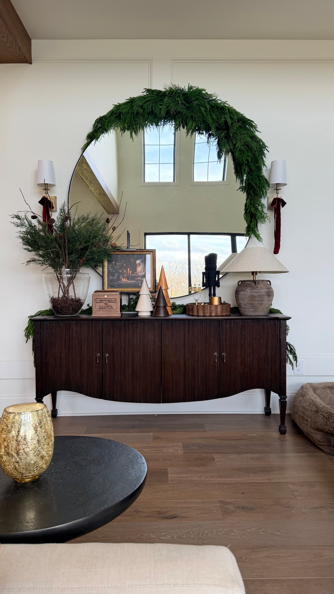 This is the greenery I used over my mirror..it’s actually a table runner, but it’s SO full, bendable, and easy to shape. It drapes beautifully and gives that lush, real-touch look without falling flat.
#holidaydecor #christmasdecor #greenswag #mirrorstyling #interiordetails #ltkhome #ltkitfinds #christmasstyling #simpleholidaydecor