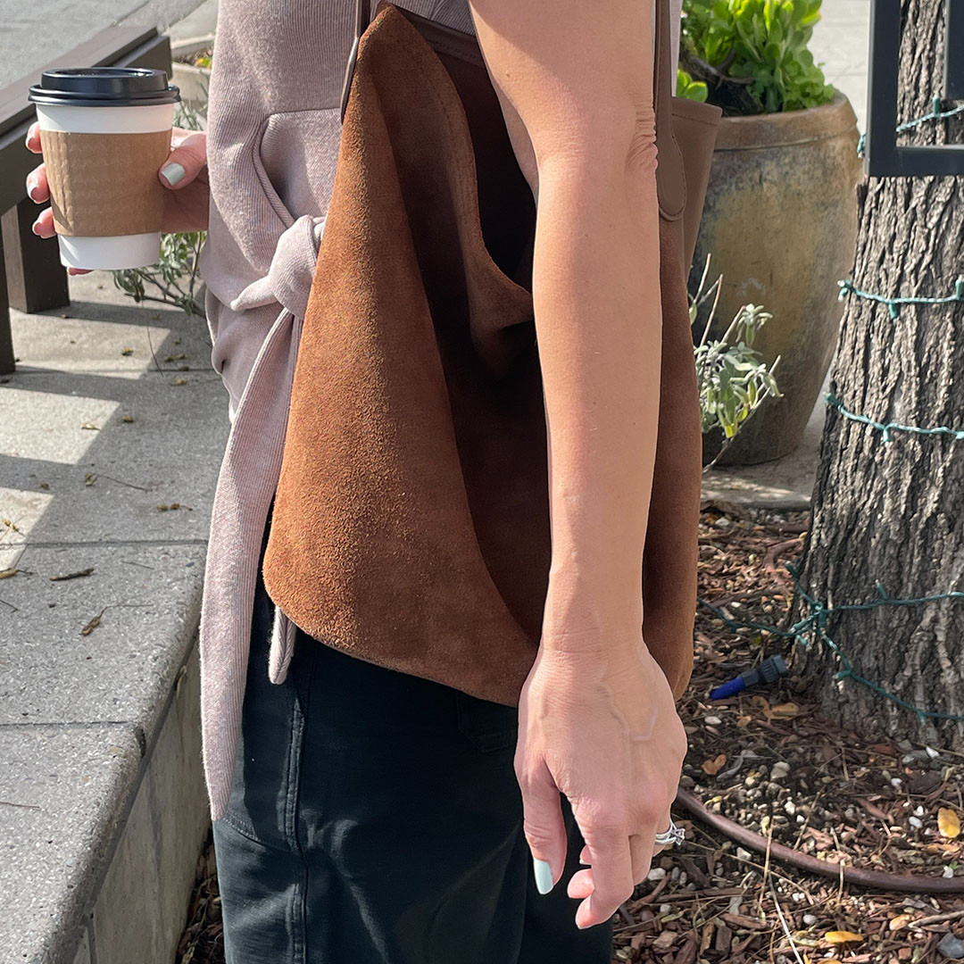 Cannot live without this slouchy bucket bag. It is lightweight, on trend, and holds everything I need to carry around-and more! Plus, it's under $200, love that! 

 #LTKOver40 #LTKWorkwear #LTKItBag