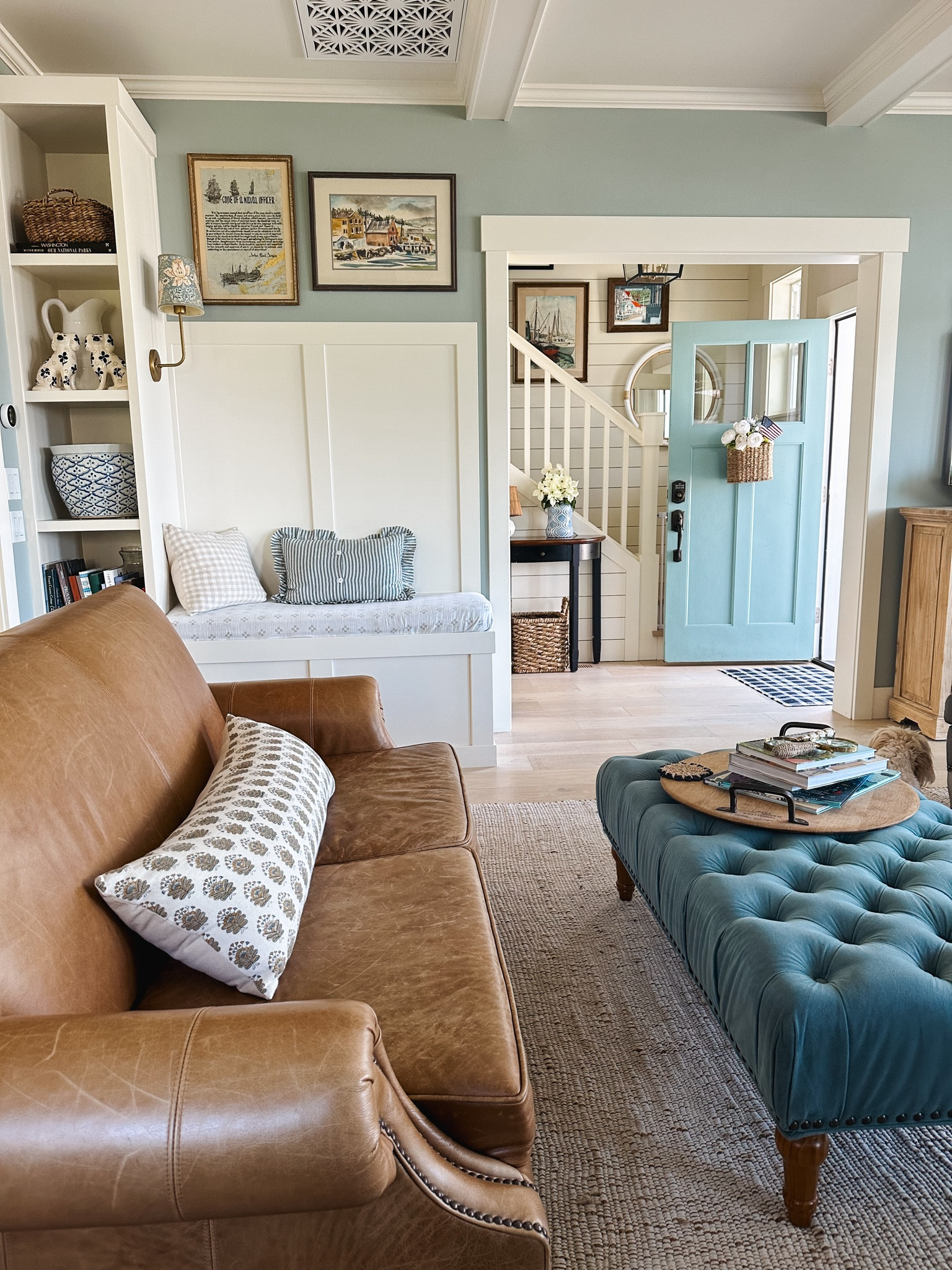 Leather chair, brass wall sconce, pattern shade, similar tufted ottomans, door basket, pillows, jute rug 

#LTKHome #LTKSeasonal #LTKSaleAlert