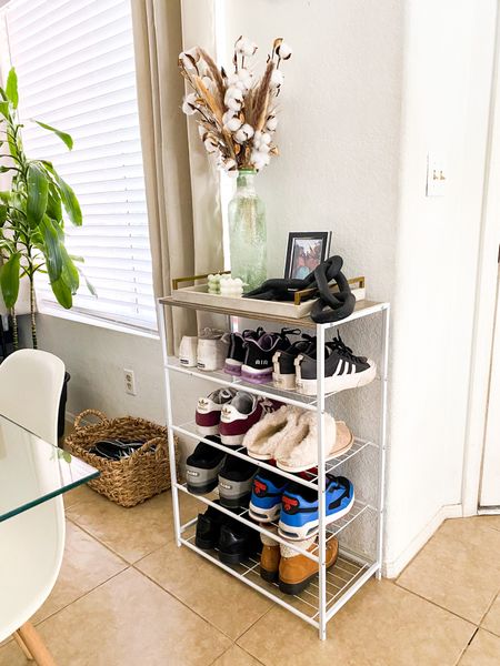 We do not have a mud room or any sort of area for all our daily shoes and accessories. So I created a small space for just that. One part- five tier shoe rack for that mess. Second- coat hangers on the wall (not shown) to hold all those coats, hats, purses, etc. 
happy with the out come! Especially because I cannot stand shoes all over the place. Baskets are another solution I use for left overs. (Highly recommend, a good basket really adds texture) 

Price ranges: $11-$55 
#founditonamazon #smallspace #messysolutions #mudroom #entryway 

#LTKhome #LTKSeasonal #LTKHoliday