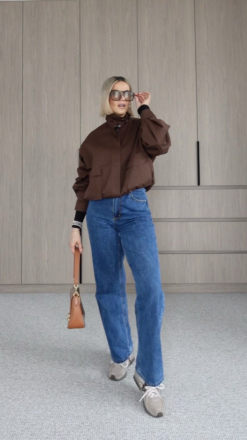 Effortless look idea for a busy day on the go and seriously the most perfect fit jeans ever! 🩵

Save for when you need inspo! 🤎

How do you like it? 

Wearing: 
Top, jeans and jacket: @aerelabel via @theiconicau 
Sneakers: @newbalance from @footlocker_au 
Sunnies: @rhodin_collection 
Bag: @coach 

#ad #melbournemums #outfitinspirations #australianmums #australianmums