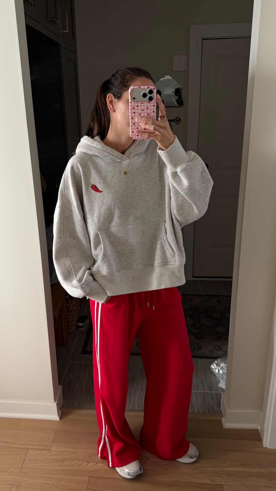 The back of the hoodie is the best 🤭🌶️ wearing a M! 
Track pants are true to size and tall girl friendly (I’m 5’7”) wearing a S 
Sneakers: tts, size up if between 

#LTKootd #LTKValentine #LTKmomlife