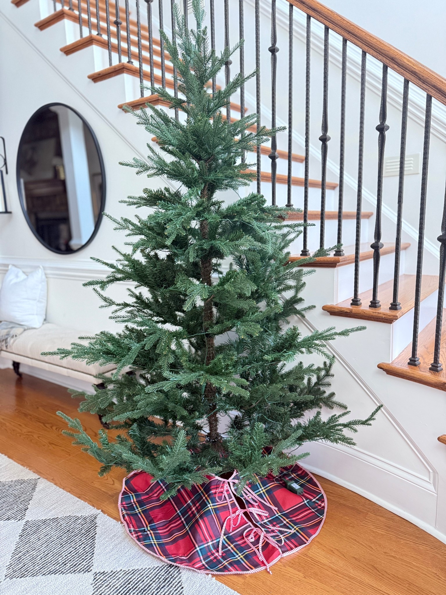 A darling 6' tree with a Scottish plaid skirt in your front entry will make a gorgeous holiday first impression. Tree and skirt linked! 

#LTKHome #LTKHoliday #LTKSeasonal