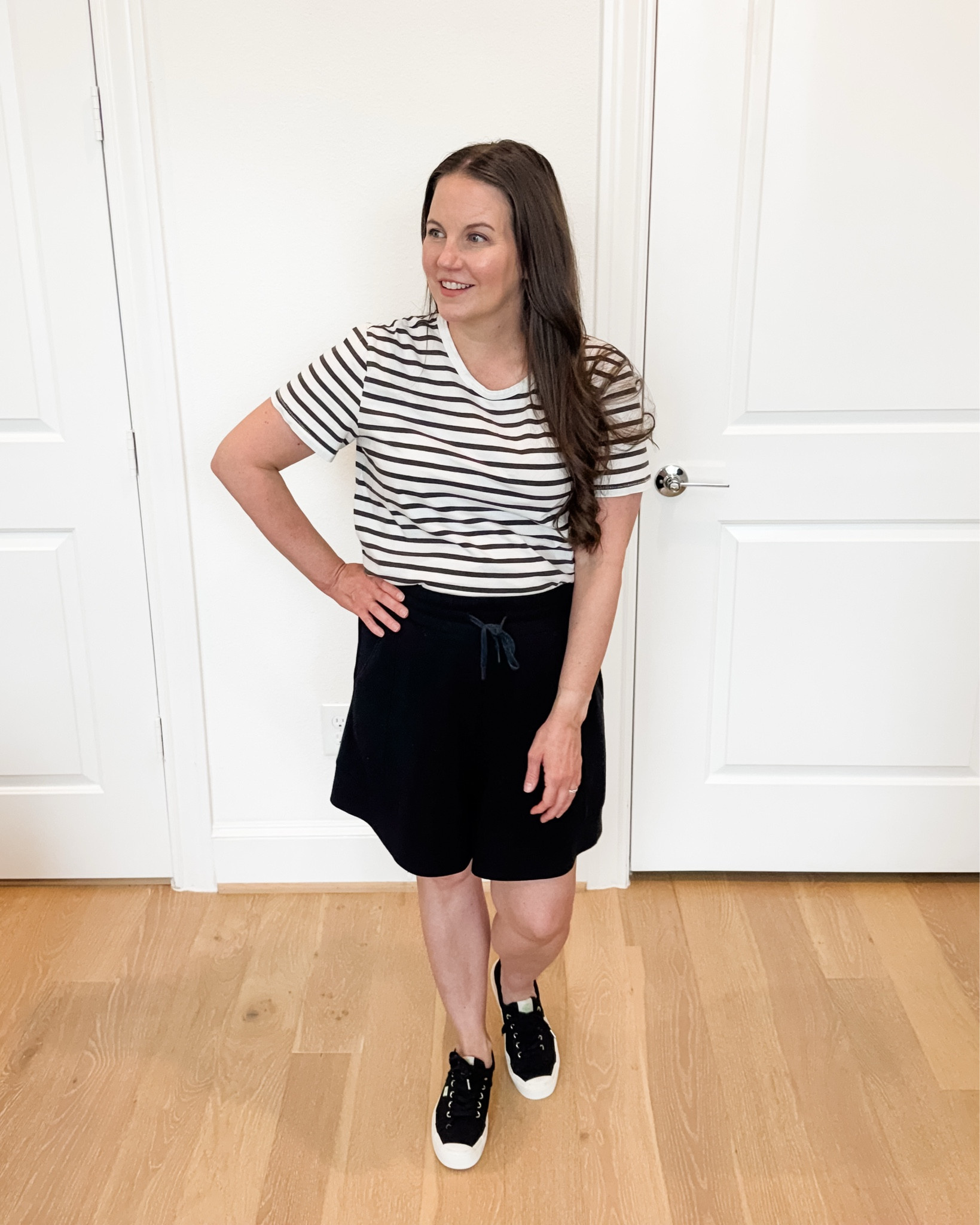 Easy summer outfits are my go-to this time of year. This casual mom outfit combines a classic striped top with comfy drawstring waist black lounge shorts and black sneakers for a look that’s comfortable, practical, and still put together. Whether you’re running errands, chasing little ones, heading to the airport, or sightseeing on vacation, this is the perfect vacation outfit you’ll reach for again and again. These black lounge shorts are lightweight, versatile, and an everyday summer staple that pairs with everything in your closet.

#LTKSeasonal #LTKmomlife #LTKOver40