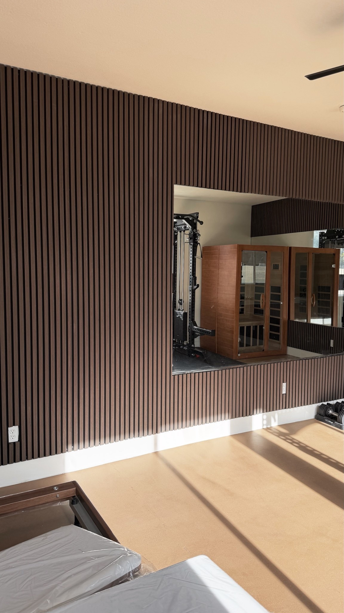 Sauna: Costco
Squat rack: Vesta Fitness

Home gym // Wall panels // Walnut paneling // Gym

#LTKHome #LTKActive