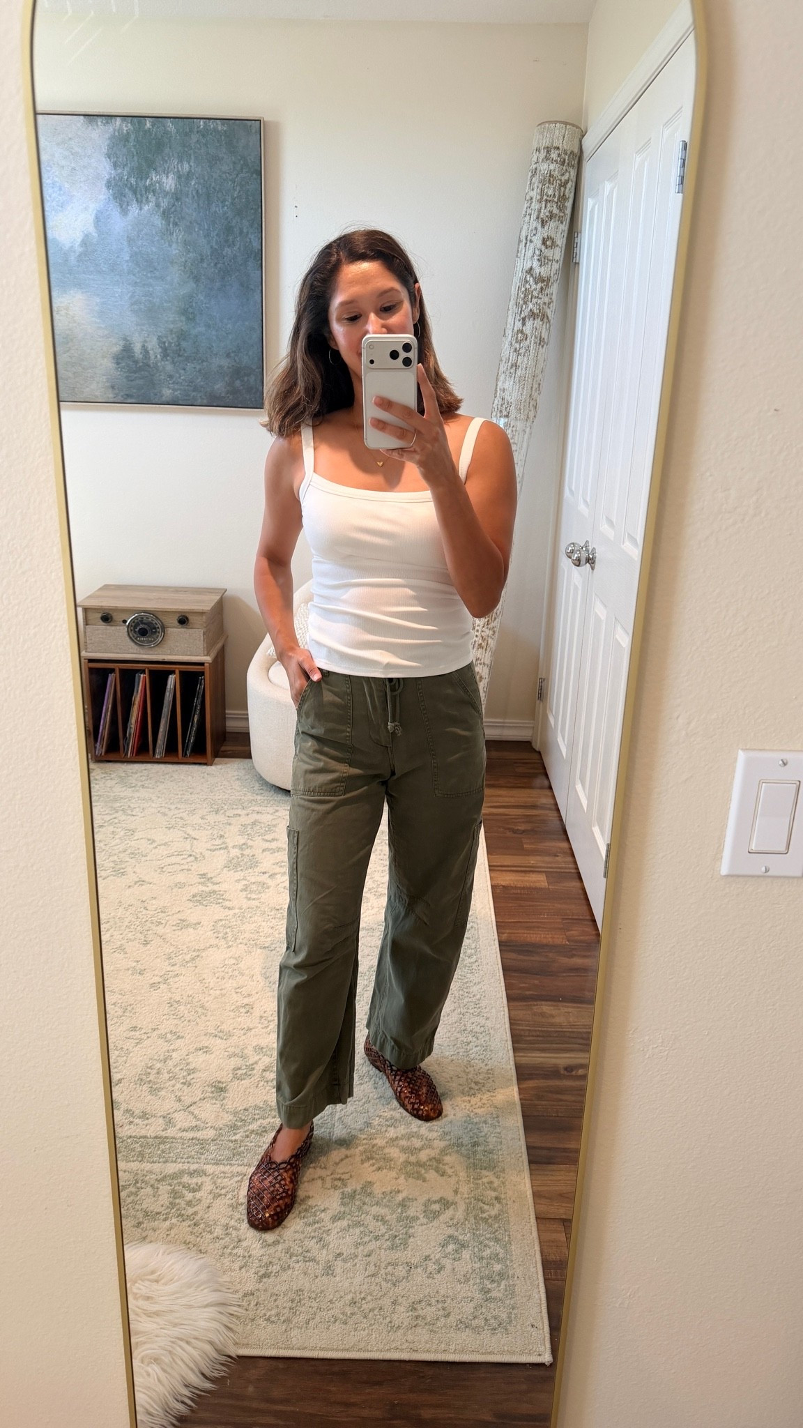 Serial Style Shopper Style Staple | This $20 padded shelf bra tank officially earned a permanent spot in my closet… so much so that I already bought it in gray and yellow too.

These are the kinds of pieces I look for: comfortable enough for everyday, flattering on their own, and easy to transition into the next season.

For fall? Just throw on a cardigan or blazer and you’re out the door.

Today I paired it with cargo barrel leg pants and Steve Madden jelly shoes for an easy, everyday look that feels put together without trying too hard.

Sizing
• Tank: Small
• Pants: 24
• Shoes: 7 (true to size)

Would you wear this now, or save it for fall? 🍂🤍

#SerialStyleShopper #CapsuleWardrobe #EverydayStyle #AffordableFashion #MomStyle #FallTransitionStyle #WardrobeStaples #OutfitIdeas #StyleOnABudget #LTKStyle

#LTKgrwm #LTKootd #LTKmomlife