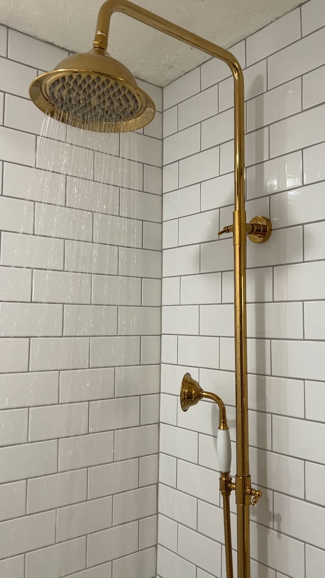 Exposed shower system. Polished brass shower head. Vintage bathroom. Brass fixtures. Bathroom vanity lighting.

#LTKitbag #LTKVideo #LTKhome
