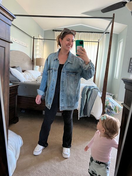 Disney outfit for a chilly Southern California morning. Mom outfit. Stay at home mom outfit. Oversized denim jacket. Black jumpsuit. Pearl hoop earrings  