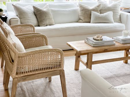 Warm neutral living room ✨ 

White couch, vintage elm wood coffee table, woven armchairs, kilim hemp pillows, textured neutral rug

#LTKhome