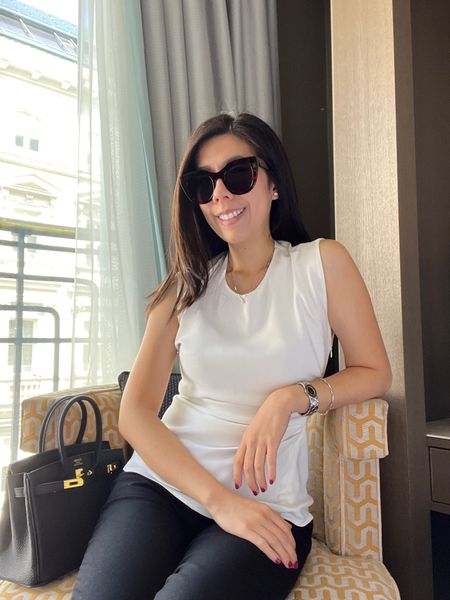 Opted for yet another black and white outfit for a day of meetings. I wore a sleeveless top from 3.1 Phillip Lim along with black cigarette pants. I accessorized with a silver Dior watch.

#LTKworkwear #LTKxNSale #LTKunder100