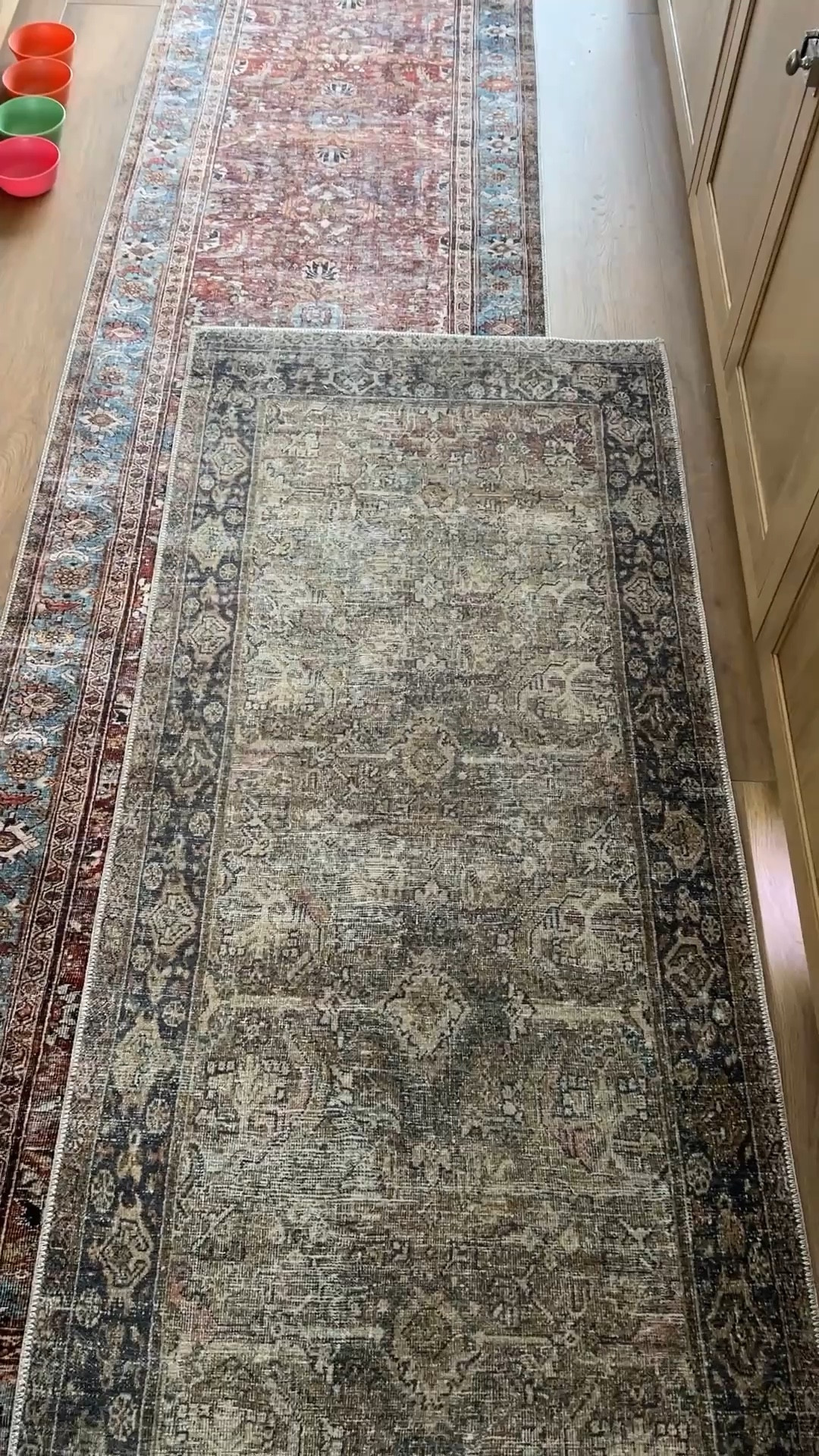 Olive and brick are the two runners shown. They are low pile and perfect for high traffic spaces. The navy rug is a cloudpile and is SO SO SOFT. I have it in two bedrooms.  Don’t forget carpet tape. I’ve used this for years in LVP and engineered hardwood without residue or issues  