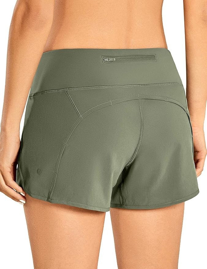 CRZ YOGA Women's Mid-Rise Quick-Dry Athletic Sports Running Workout Shorts with Zip Pocket - 4 In... | Amazon (US)