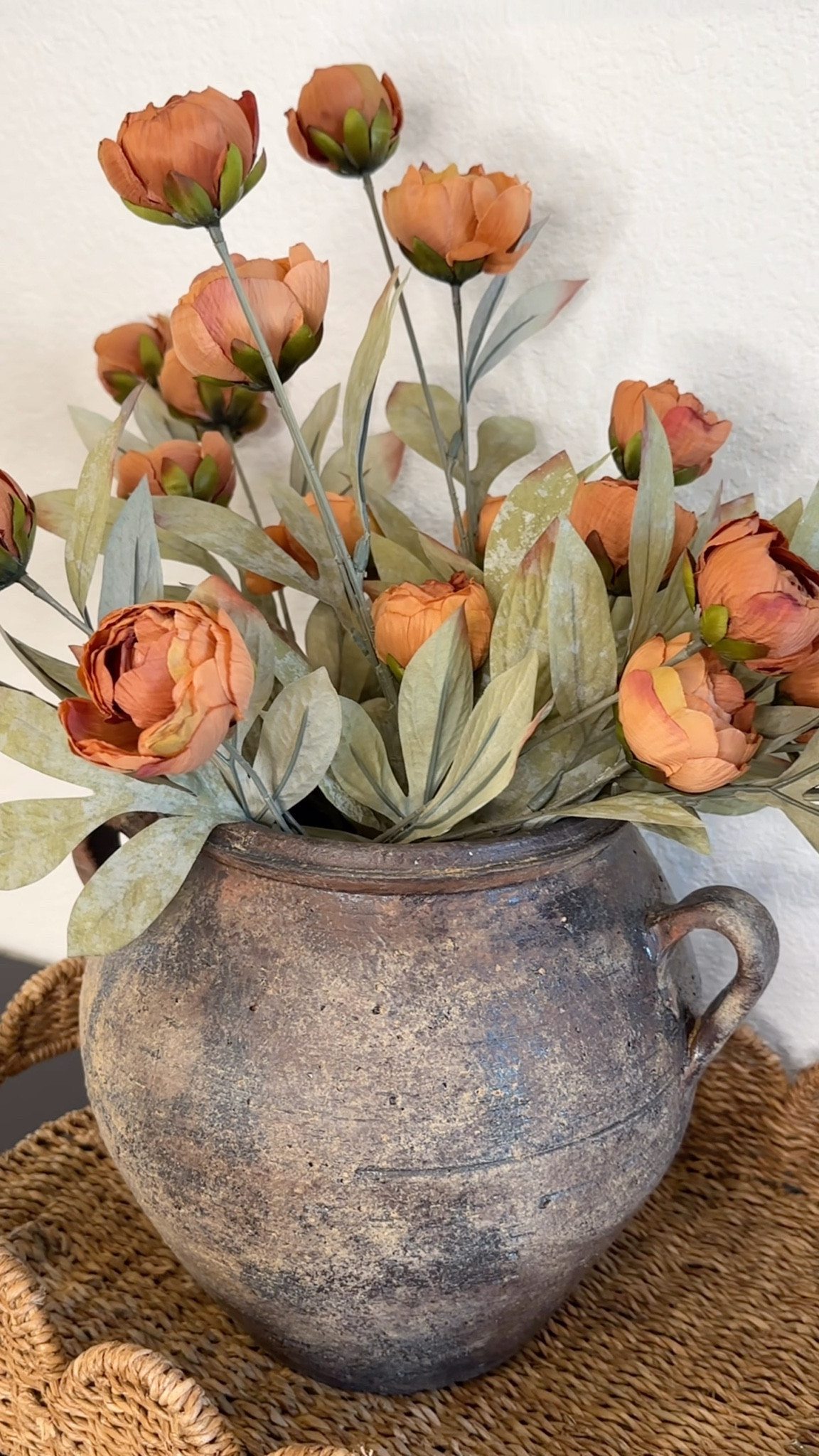 The oval rattan tray is perfect for styling a console table or on top of  dresser! I added this beautiful old world pot with peonies and the glass hurricanes with flameless candles. The butterfly fit perfectly!

#LTKHome