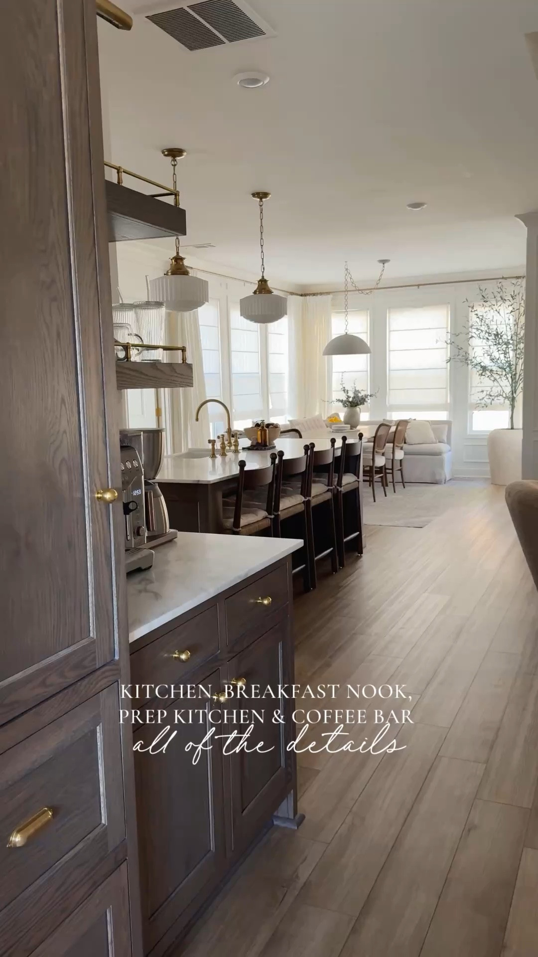 Answering the TOP questions about my open concept kitchen, breakfast nook, prep kitchen, and coffee bar:
 Want to shop this space? Comment “info” for all of the details

Cabinet species + stain: My cabinets are white oak. A local company custom-matched the color starting with a blend inspired by Minwax Aged Barrel and Simply White. The ratio was close to 4:1, with Simply White being the dominant tone.

Countertops: Calacatta Borghini Extra, 2 cm, honed from @surfaceproviders.

Paint color: Benjamin Moore Simply White.

Prep kitchen cabinet color: Also Benjamin Moore, in Swiss Coffee.

Coffee bar railing details: Just like my hardware, the rails are unlacquered brass and I sourced them from Etsy.

Flooring: Shaw Floorte Pro Paladin Plus in Marina.

Why we kept LVP over hardwood: This is what came with the house, and it didn’t feel worth switching everything out. But honestly, LVP tends to hold up really well for everyday life—especially with kids and dogs. It’s more resistant to scratches, moisture, and general wear compared to hardwood, which made it the practical choice for this season of life.