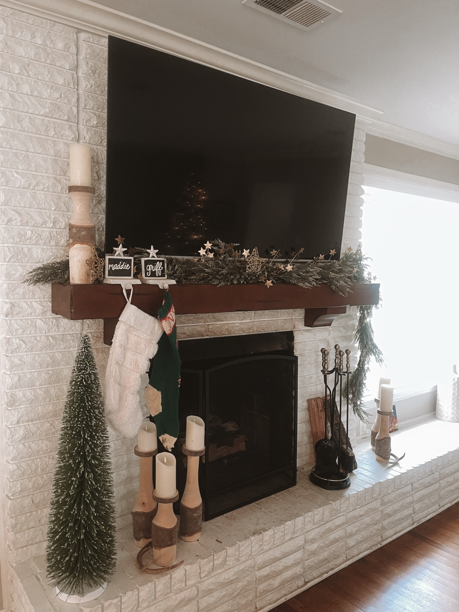 Star decor. Christmas decorations. Mantle inspo. Stockings. Gold glitter garland. Fur stockings. Large bottle brush trees. Candlesticks. Gold star garland. Gold star ornaments  

#LTKHome #LTKHoliday #LTKSeasonal