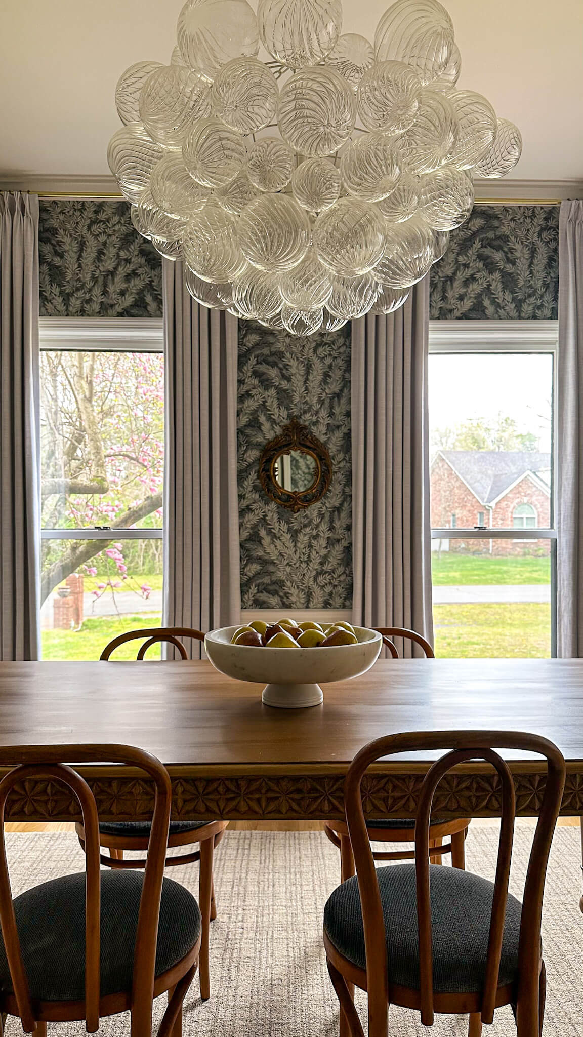 Spring refresh for the dining room! I shopped my home and removed some things, and am loving the clean look. I feel like the wallpaper and bubble chandelier really get to shine, and I have a lighter feeling as we enjoy spring. 

 #diningroomideas #diningroom #diningroomdecor #springrefresh #springdecor #homedecor #interiordesign #wallapaperideas #statementchandelier 

#LTKHome #LTKStyleTip