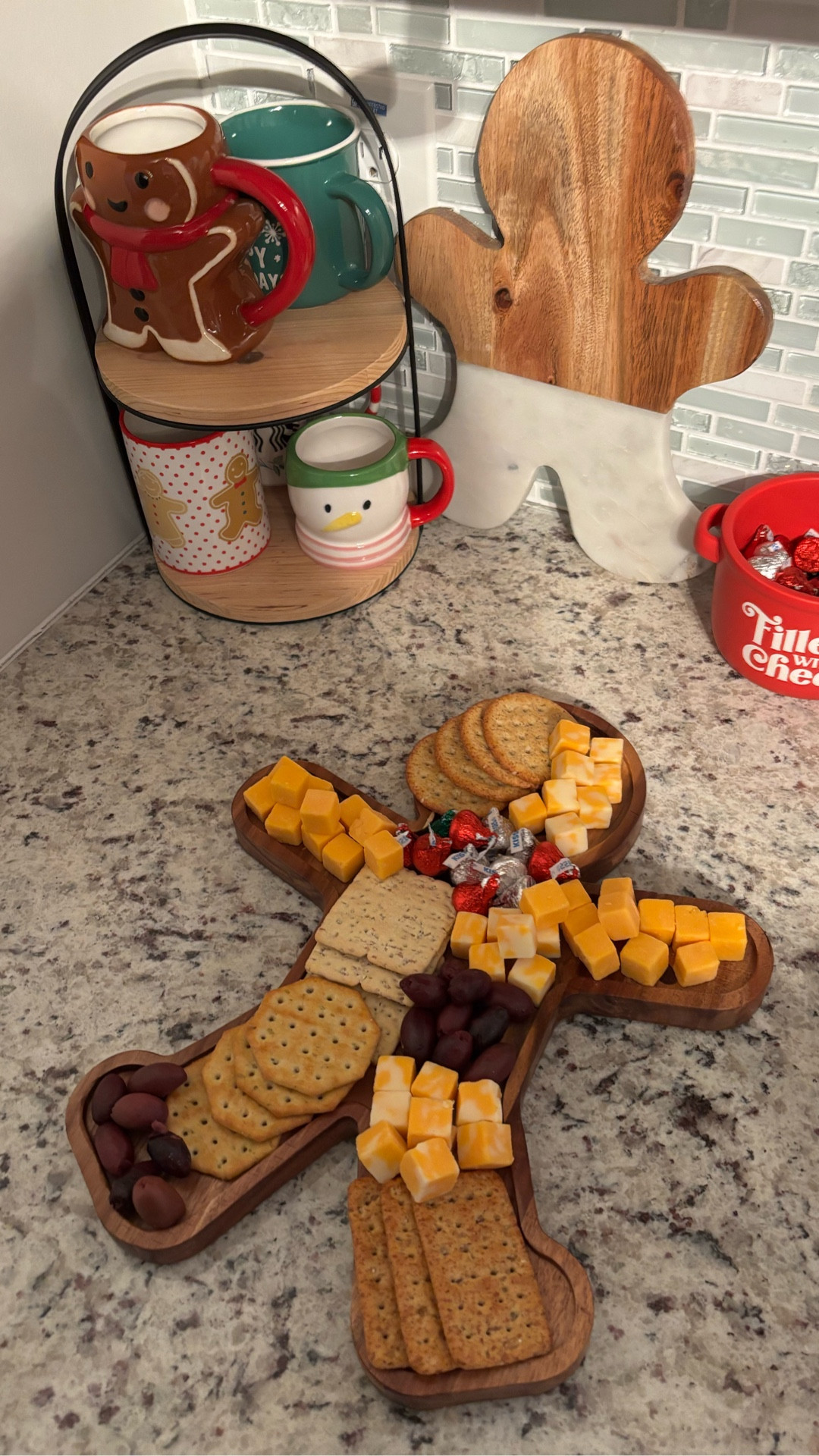 Let’s make a cheese board for a Friendsgiving gathering! 🧀🦃I love how cute this gingerbread-man shaped board is! What are your favorite things to include on a board? 
•
•
•
 #cheeseboard #cheese #walmartfinds #walmart #hersheykisses #friendsgiving #charcuterieboard #diy #foodieofnc #inthekitchen #foodpics #cheeseandcrackers #olives 

#LTKdayinmylife #LTKGiftGuide #LTKHoliday