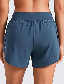 CRZ YOGA Mid Waisted Dolphin Athletic Shorts for Women 4" Lightweight High Split for Gym Workout ... | Amazon (US)