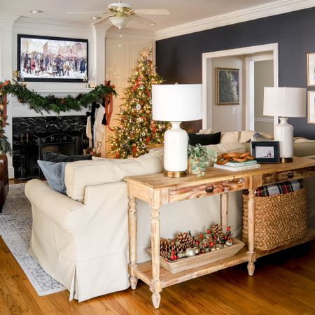 My living room decorated in red plaid highlights my sofa table, picture frame TV, and Pottery Barn sofa.

#LTKhome #LTKHoliday