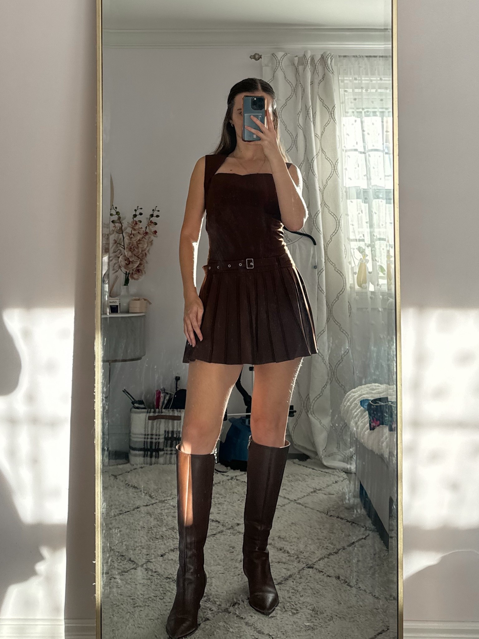 🤎 Fall outfit inspo 🍂 This chic brown mini dress paired with brown knee high boots is the ultimate fall staple. Add a matching shoulder bag, gold hoop earrings, and minimal jewelry for an effortlessly elevated look that transitions perfectly from day to night.

Perfect for a fall brunch, casual date, pumpkin patch visit, or weekend city stroll.
.
.
.
.
#LTKSeasonal #LTKU #LTLSaleAlert #LTKFindsUnder50 #LTKFindsUnder100 #LTKStyleTip #LTKTravel #LTKShoeCrush #LTKItBag 

Fall outfits | fall dresses | dress outfit | brown dress | mini dress outfit | pleated dress | date night outfit | date night dress | fall shoes | fall boots | boots outfit | brown boots | tall boots | brown knee high boots outfit | outfit ideas | pumpkin patch outfit | fall bags | 