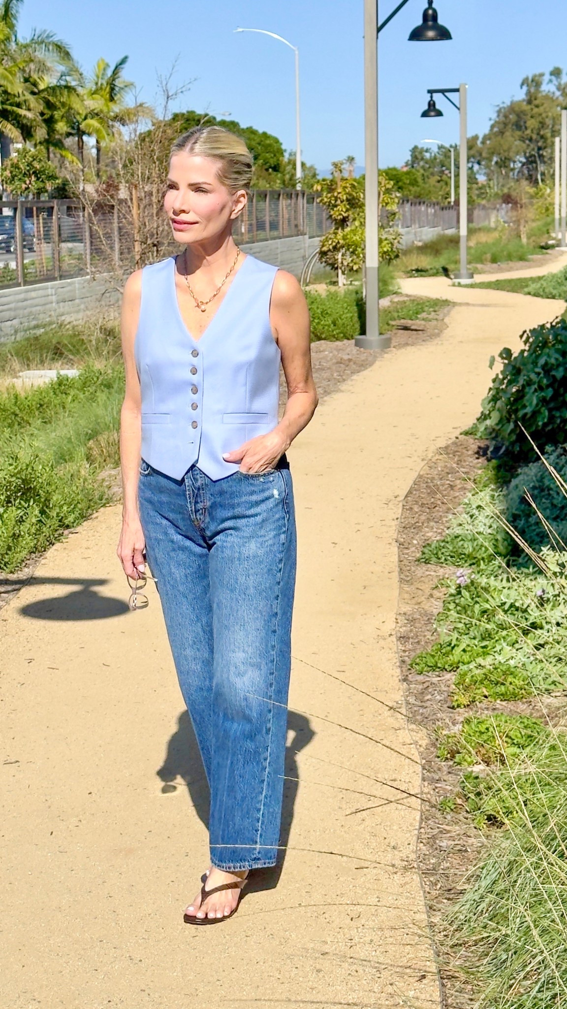 My blue vest is an oldie but goodie from Banana Republic so I’m linking a Quince vest that’s almost identical in color. 
Love the straight high waisted Pistola jeans. 
The chocolate crocodile kitten heels are really comfortable & the low height makes them easy to walk in. 

#LTKootd