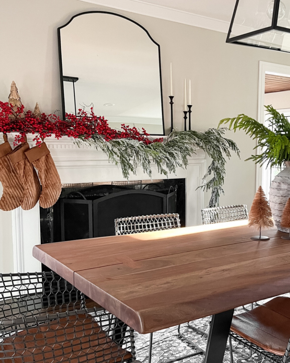 Christmas holiday mantle styling with berries and pine garland 

#LTKSeasonal #LTKhome #LTKHoliday