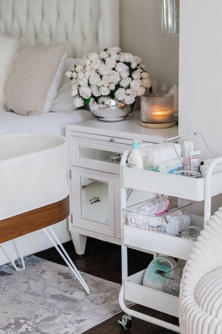 A bedside cart for a newborn should include essentials like diapers, wipes, a changing mat, extra onesies, burp cloths, a small blanket, and any feeding essentials such as bottles or breastfeeding supplies. Having these items close at hand makes nighttime care convenient and comfortable. I’ve linked all my favorites! 