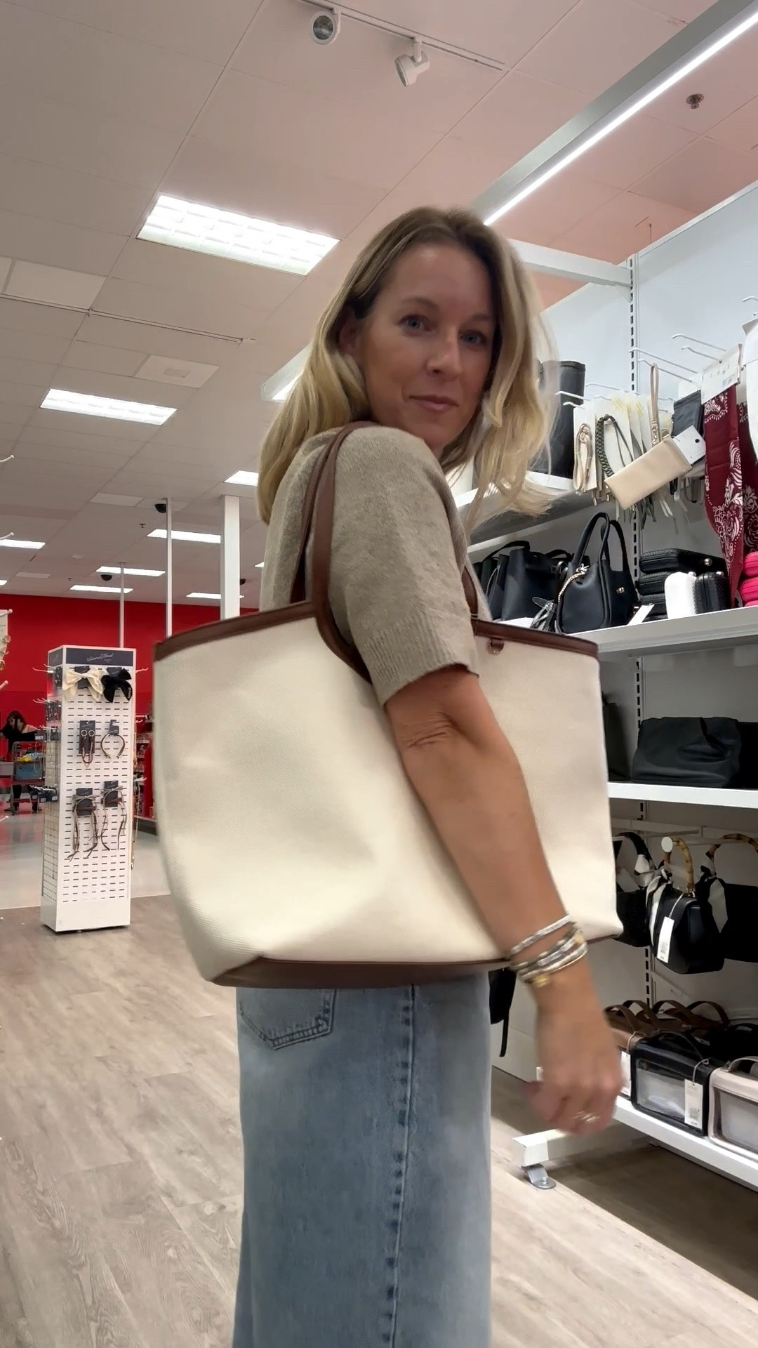 Oh my my, the goodness that is target right now is insane. I almost left with 30 new bags but toned it down and walked out with only 3 😉 they’re so good and for those of you loving my goyard vibe but don’t wanna spend the $$$ how perfect is this geo tote?! The white canvas is next level too. I’m obsessed. 
Outfit deets: large top, 29 jeans. Shoes I may size up 1/2–1  

#LTKItBag #LTKFindsUnder50 #LTKSaleAlert