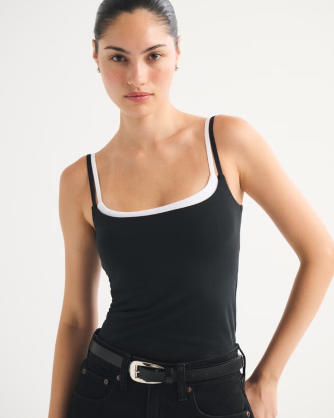 An everyday staple you’ll reach for constantly 🤍 The Abercrombie Bra-Free Double-Layered 90s Cami is part of their bra-free collection with removable pads for easy coverage and support. Made in their ultra-soft cotton-blend seamless fabric, it has that perfect 90s-inspired fit with a flattering square neckline and double-layer design. So easy to style with denim, skirts, or under layers for a clean, seamless look ✨ 

 #LTKSpringSale #LTKootd #LTKSaleAlert