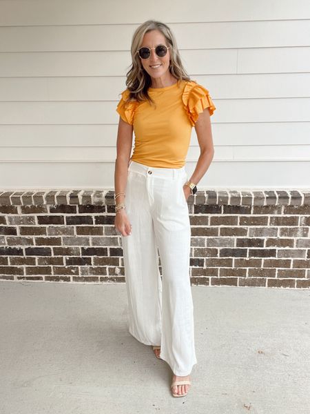Linen blend trouser pants with a cute ruffle, detailed top. Top comes in multiple colors. Wearing a size small. 

#LTKStyleTip #LTKFindsUnder50