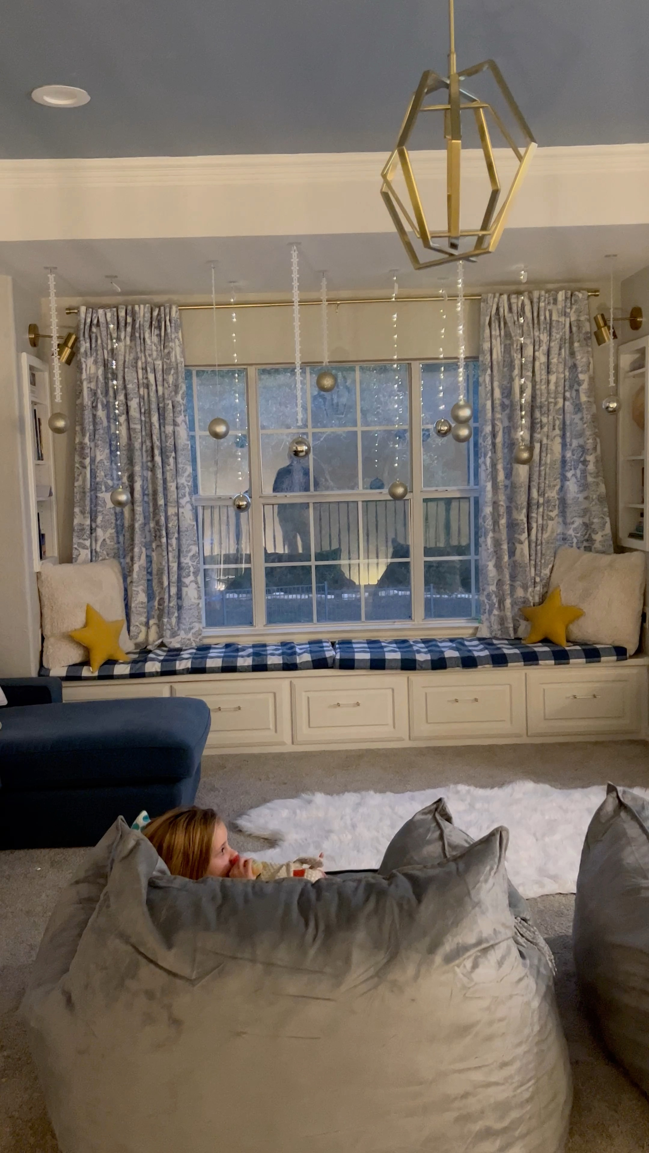 I used command hooks on the ceiling to hang these ornaments from target! I alternated using  snowflake ribbon and led fairy lights to hang 12 at varying heights. I bought led lights with the smallest battery I could find and used museum putty to keep those up on the ceiling after wrapping the string of lights around the command hook. Then I twisted the lights into different lengths and cut the snowflake ribbon to varying lengths. I used the ornament hooks included in the package to hang the ornaments from the lights and ribbon 🎀 

#LTKhome #LTKHoliday #LTKSeasonal