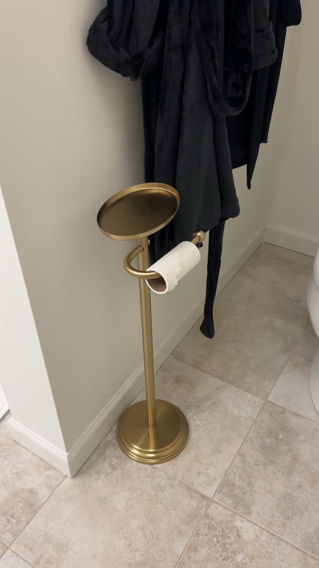 This gold toilet paper holder from target will elevate your bathroom decor. Perfect for an apartment or rental or if you don’t want to drill holes in your home  

#LTKOver40 #LTKHome #LTKmomlife