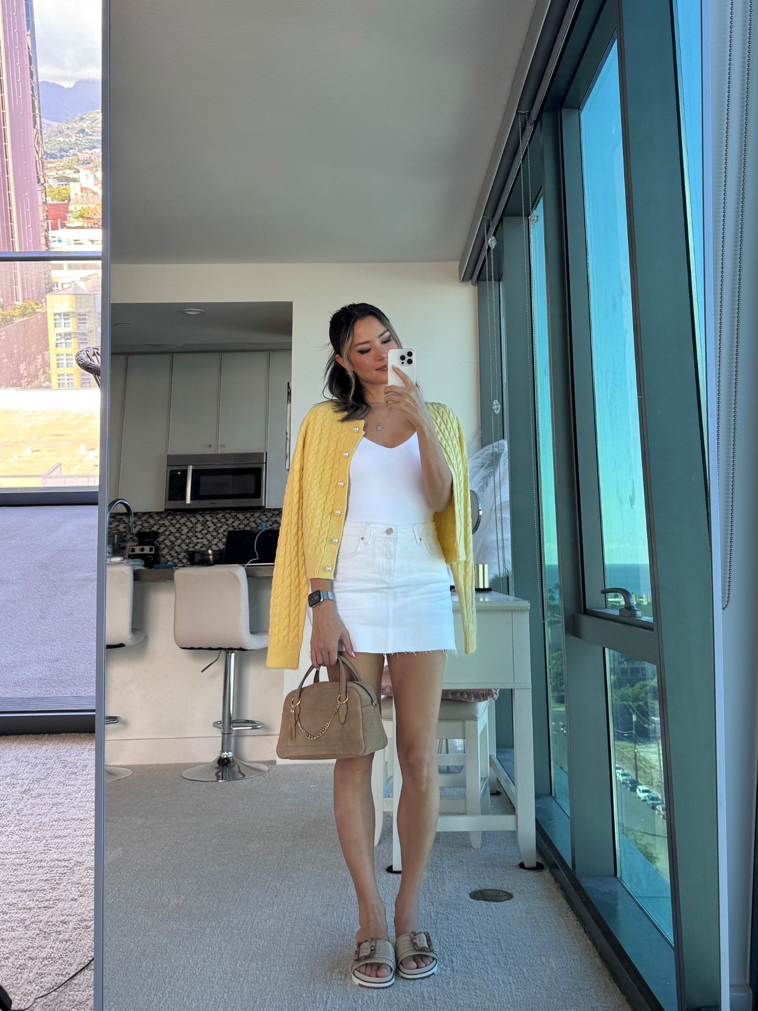 Love this comfy + casual look (obsessed with every item in this outfit!) and butter yellow is the perfect fun pop of color!!! 👏🏼👏🏼 wearing small in the yellow cardigan, small in the white bodysuit, XS in the mini skirt, true to size sandals

#LTKStyleTip #LTKxMadewell #LTKFindsUnder100