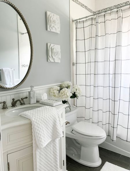Bathroom refresh! White bathroom vanity, oval beaded mirror,  bathroom accessories, simple black and white windowpane shower curtain, It also comes with a liner and hooks for easy set up!  A marble soap dispenser, marble tray, best selling fluffy white cotton towels, textured towels, a soft on your feet white rug, wall plaques. Walmart, Home Depot, Wayfair, Ballard Designs, Pottery Barn. Walmart home, home decor accessories, bathroom decor, coastal, cottage, modern farmhouse, classic, traditional, modern traditional home style. Under $50 Under $25


#LTKsalealert #LTKhome #LTKunder50