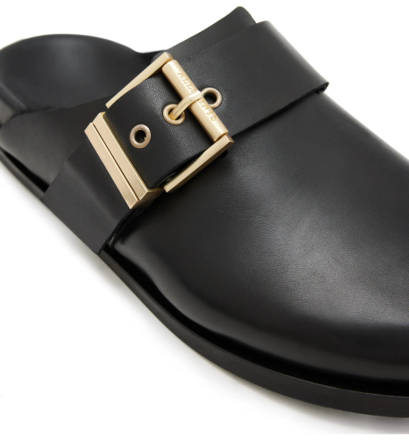 Soft shearling lining provides a cozy finish for a streamlined mule embellished with a sleek buck... | Nordstrom