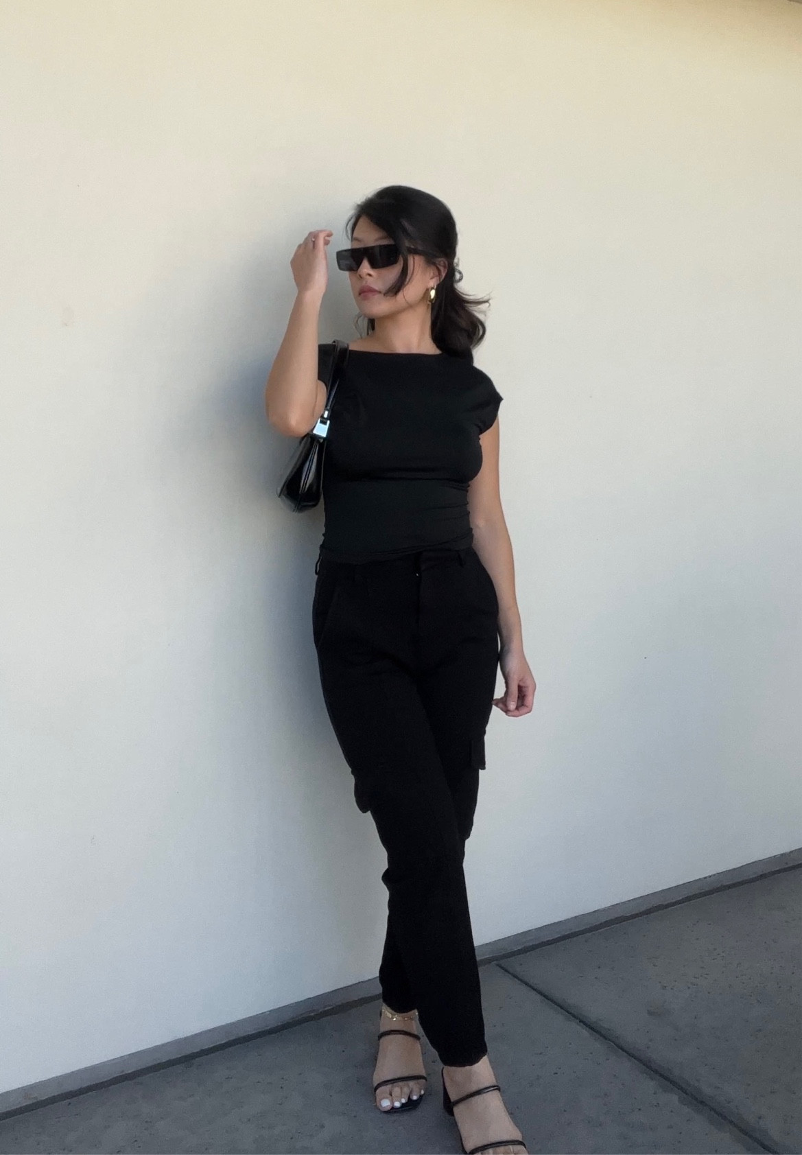 All black outfit, casual ootd, dark aesthetic, backless shirt, cargo pants, small handbag, black outfit ideas, style inspo

#LTKsalealert #LTKstyletip #LTKfindsunder100
