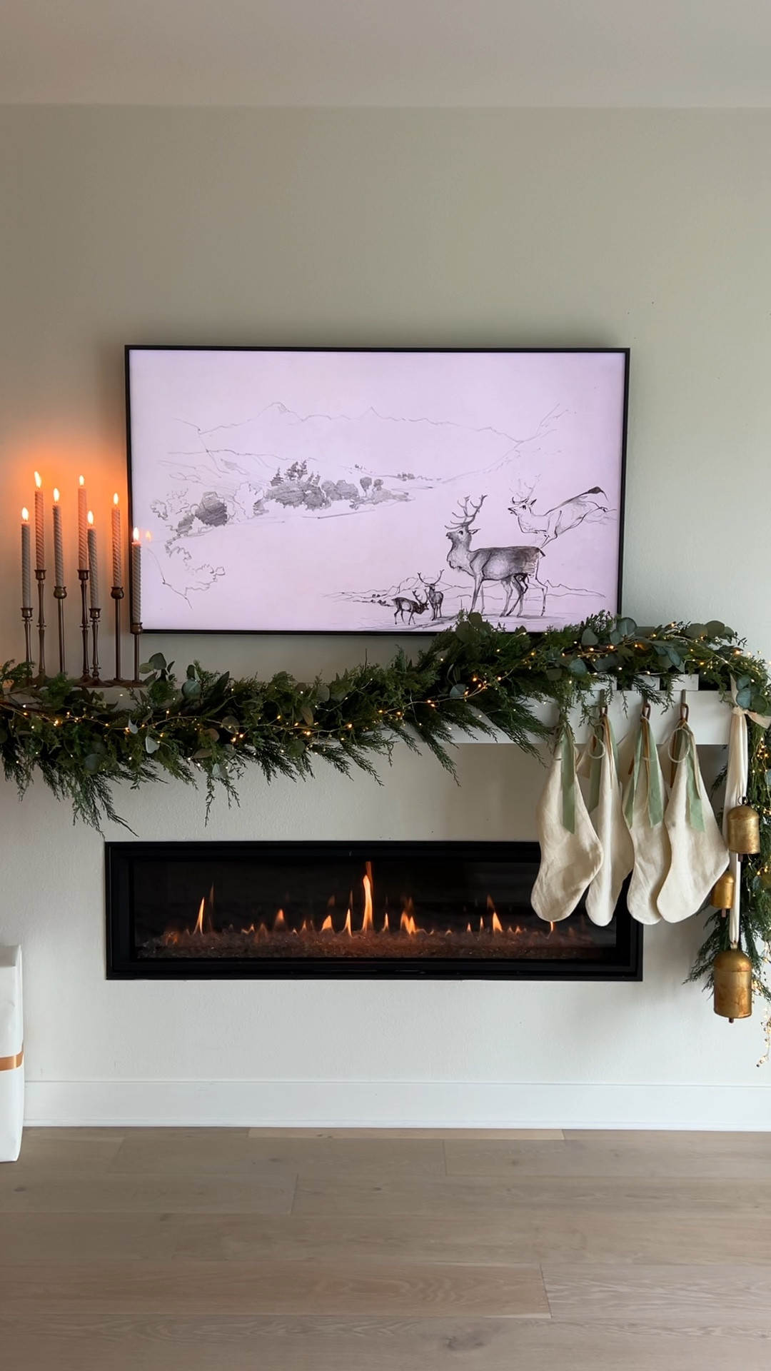Christmas mantel with layered garlands. 

Christmas mantle with garlands, candle stick holders, candle sticks, stockings, stocking holders, Christmas bells, frame tv art.

Christmas neutral decor, Christmas mantle, neutral holiday decor, Christmas, fairy lights, modern organic Christmas, fireplace, garland bells, holiday decor, real touch garland, garland fireplace. 

#LTKSeasonal #LTKhome #LTKHoliday