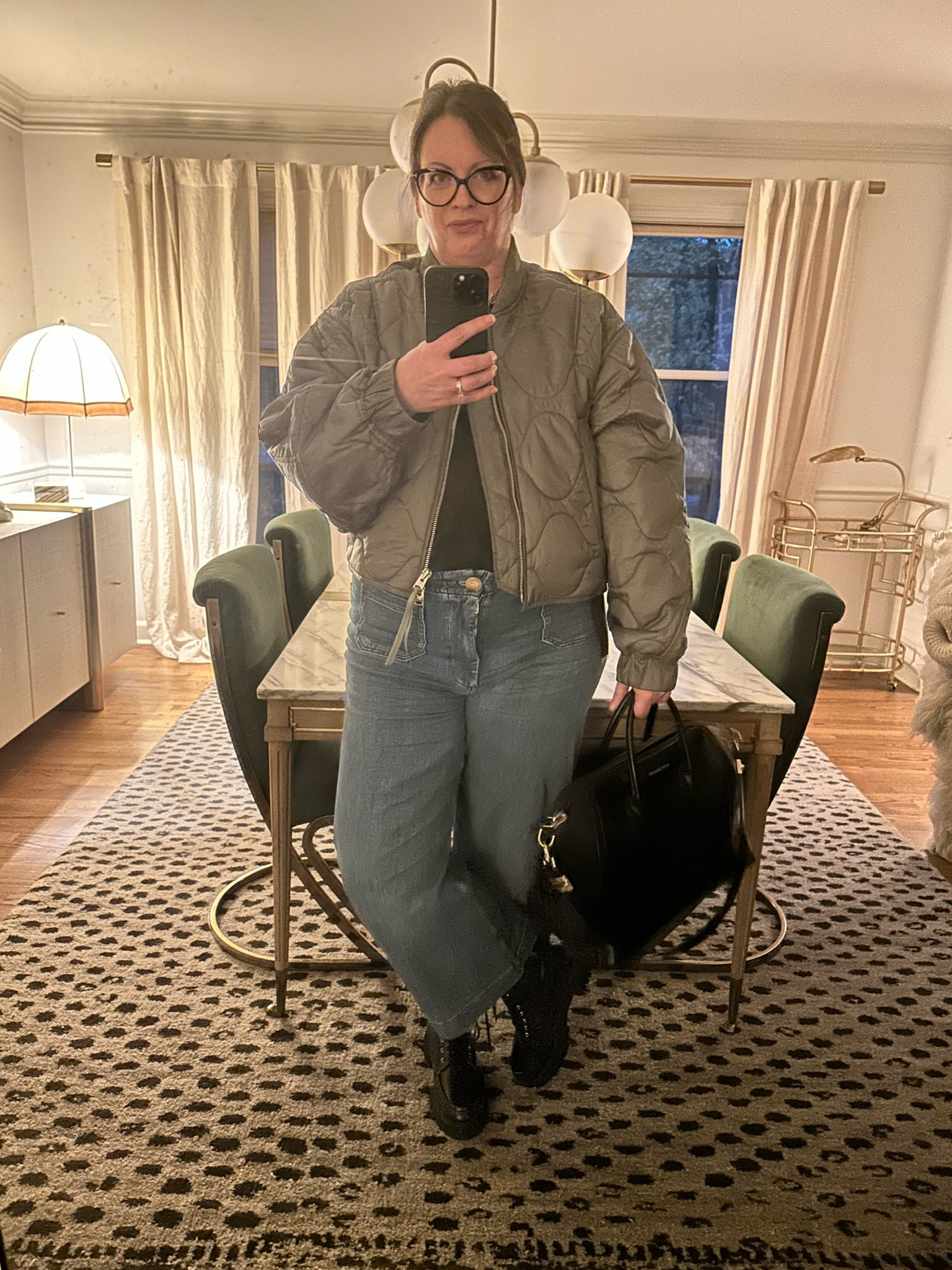 Headed out for a cocktail. I had this quilted army green bomber jacket in my top 9 fall fashion trends picks and I’m obsessed with it - it does run big but it’s meant to be oversized. I’m wearing it over my Art School Dropout tank that’s no longer available but I chose a few others that are similar. #quiltedjacket #greenjacket #olivegreenjacket 

#LTKover40 #LTKstyletip #LTKmidsize